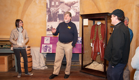 A group of guests tours the Powder Magazine
