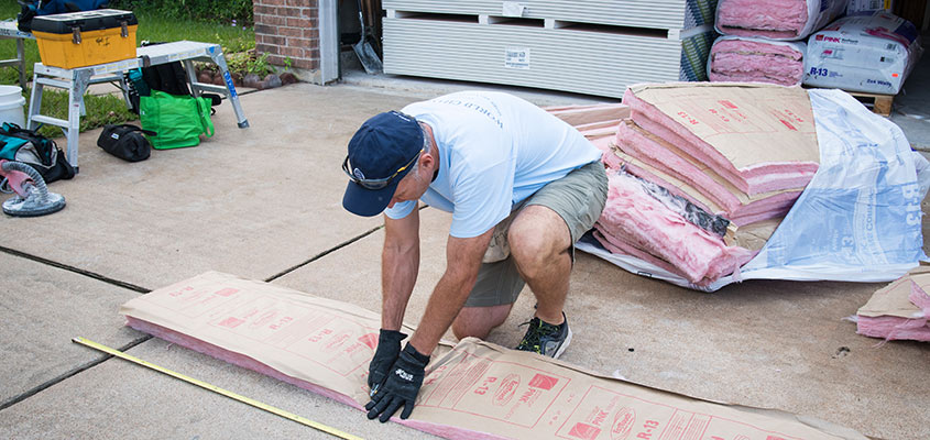 Cutting drywall to install after Hurricane Harvey.  © 2017 Audra L. Gibson. All Rights Reserved.