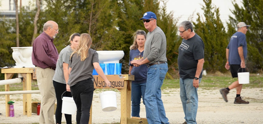 A team comes together to work on their water challenge.