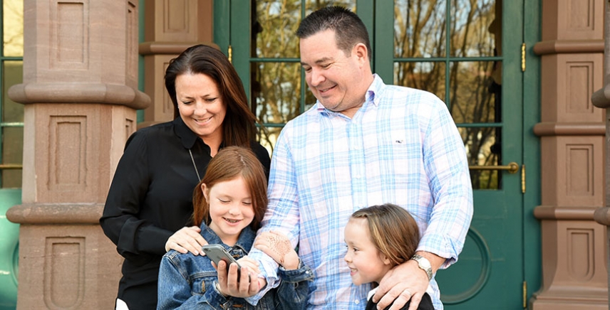 A family checks for their next clue in the Charleston Trivia Hunt.