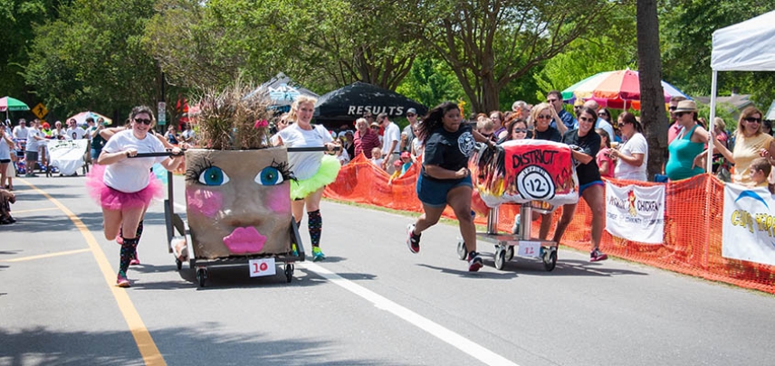 Teams race head to head in the Charleston Bed Race.
