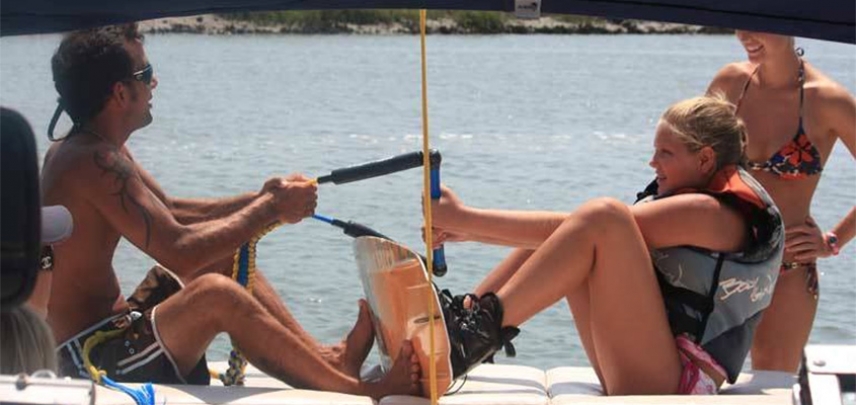 A guest gets wake boarding tips from a Tidal Wave instructor.