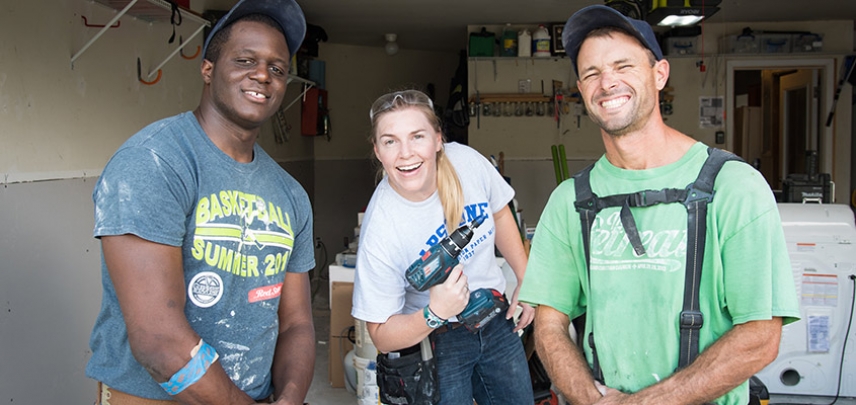 Don, Audra, and Butler taking a break after finishing drywall in the garage.